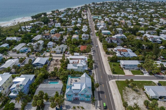 aerial view with a view of the beach and a water view