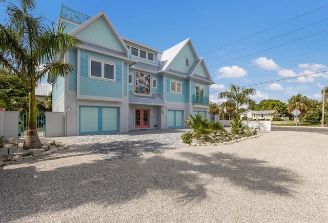 view of front of property featuring a garage and french doors