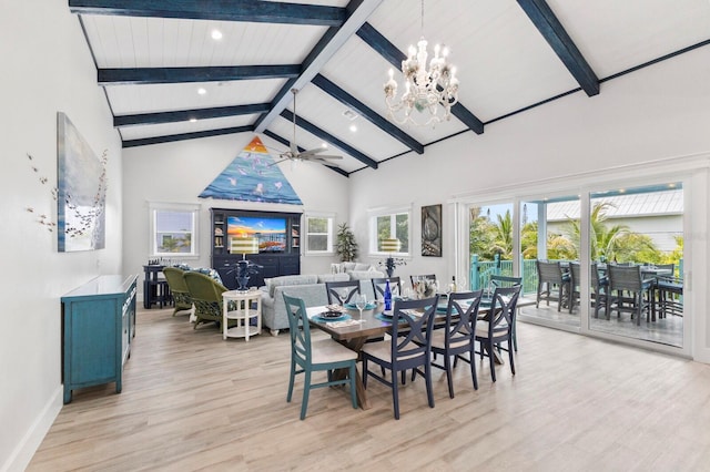 dining area featuring beamed ceiling, ceiling fan with notable chandelier, high vaulted ceiling, and light hardwood / wood-style flooring