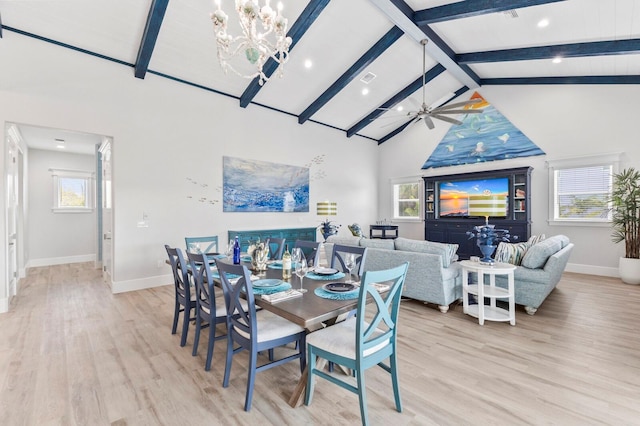 dining space with light hardwood / wood-style floors, ceiling fan, and plenty of natural light