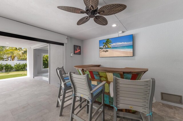 dining space featuring ceiling fan