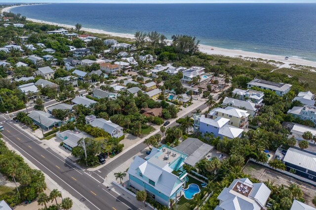 bird's eye view featuring a view of the beach and a water view