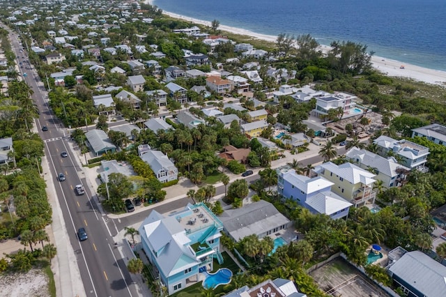 bird's eye view featuring a water view and a view of the beach