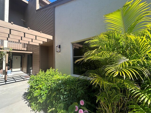 doorway to property featuring a balcony