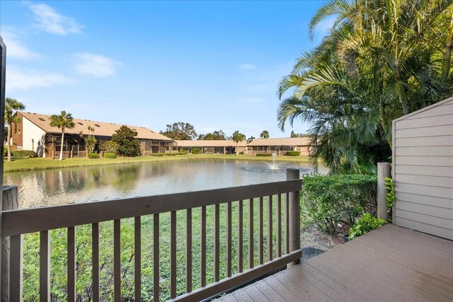 exterior space with a yard and a water view