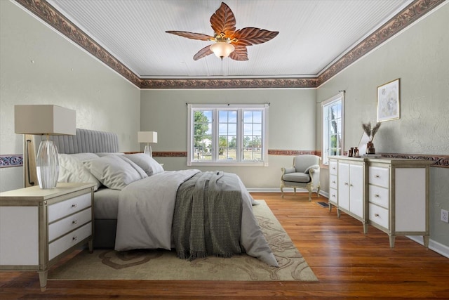 bedroom with hardwood / wood-style floors and ceiling fan