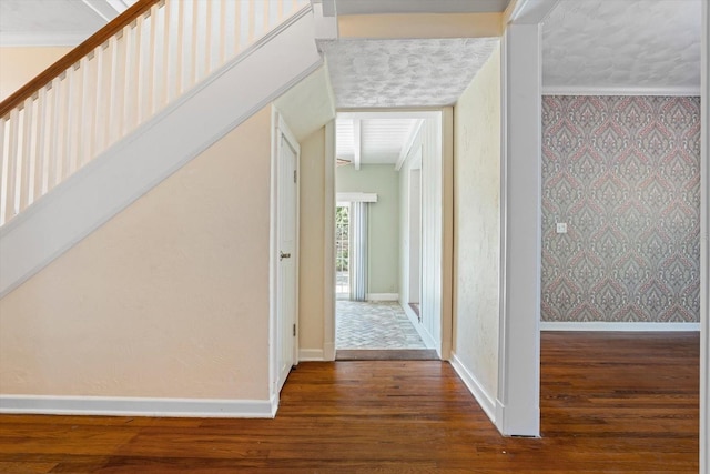 corridor with crown molding and dark wood-type flooring