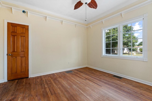 empty room featuring hardwood / wood-style flooring and ceiling fan