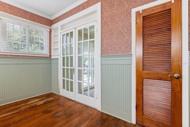 doorway to outside with crown molding and dark wood-type flooring