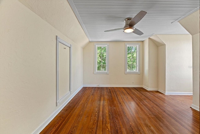 additional living space featuring wood-type flooring, vaulted ceiling, and ceiling fan