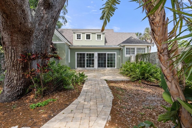 rear view of house featuring a patio