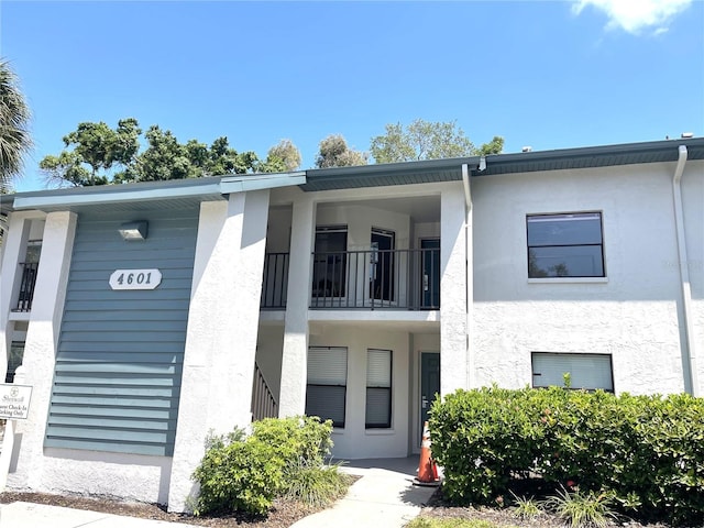 view of front of home with a balcony