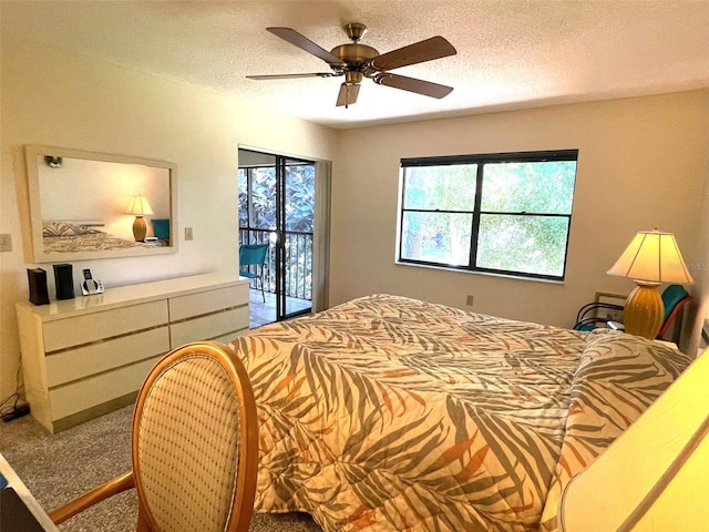 bedroom with a textured ceiling, ceiling fan, light carpet, and access to outside