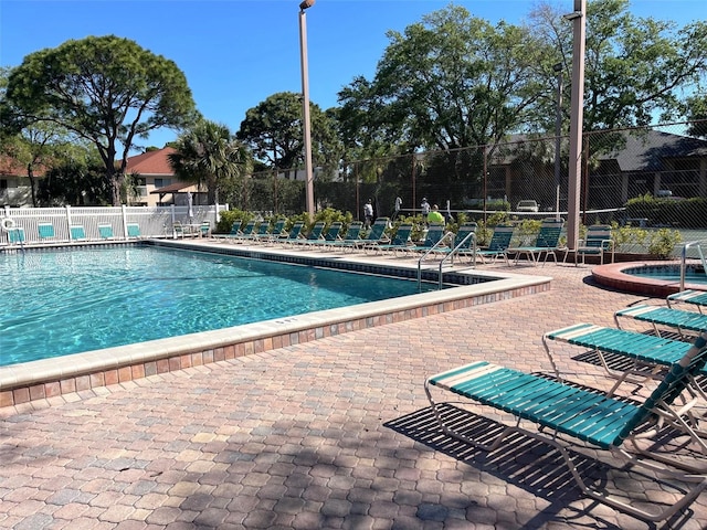 view of swimming pool with a patio