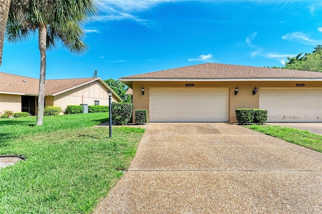 ranch-style home with a front yard and a garage