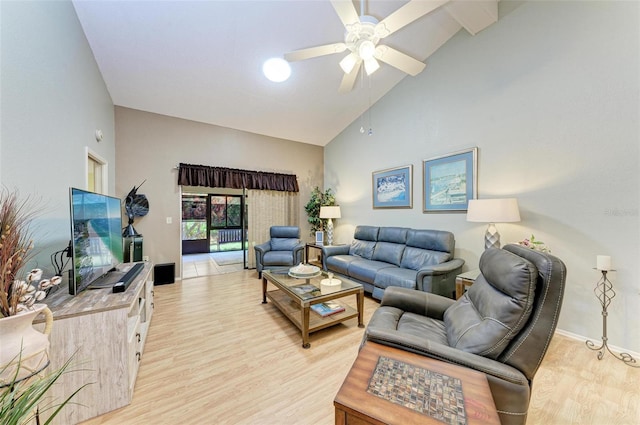 living room featuring high vaulted ceiling, ceiling fan, and light hardwood / wood-style flooring