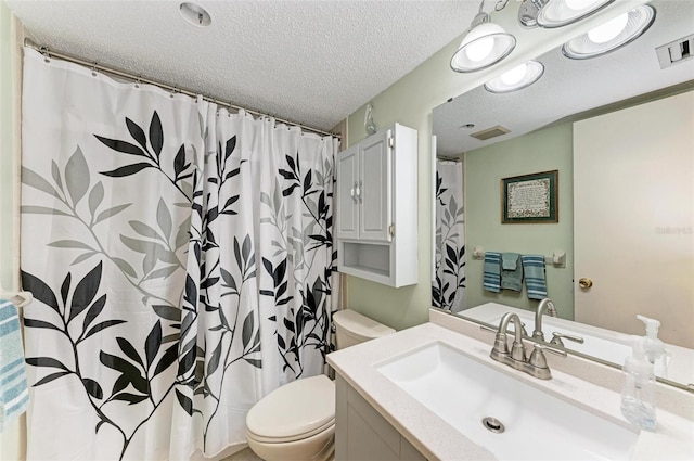 bathroom with toilet, a textured ceiling, and vanity