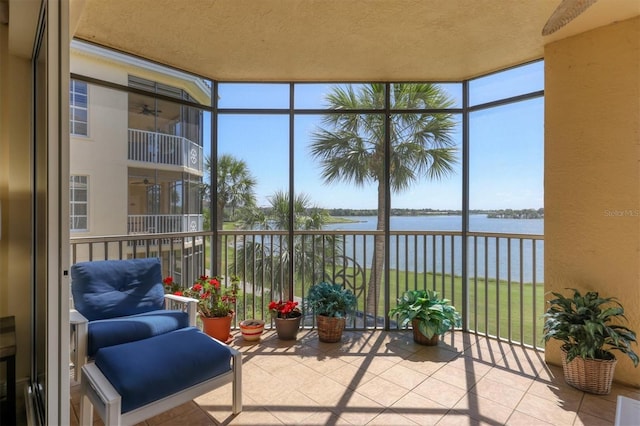 sunroom / solarium with a water view