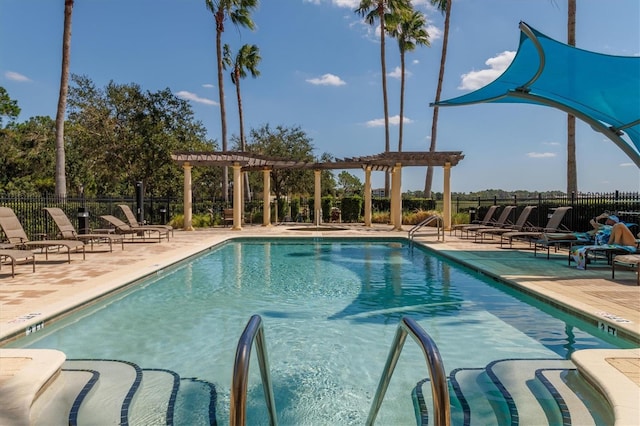 view of pool with a pergola and a patio