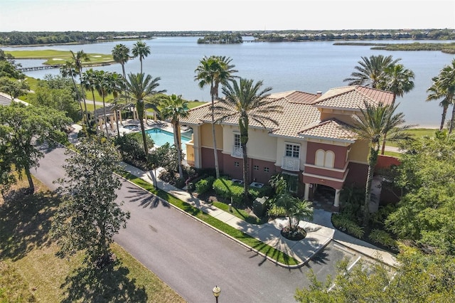 birds eye view of property with a water view