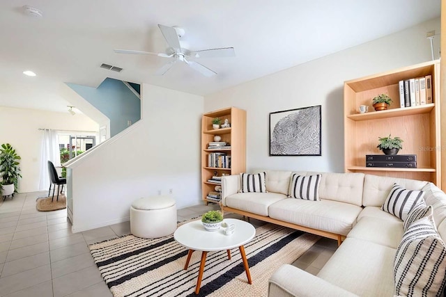 living room with light tile patterned floors and ceiling fan