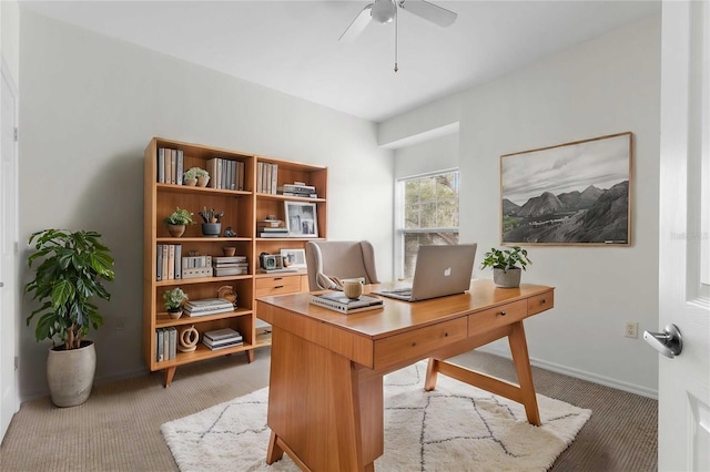 office with carpet flooring and ceiling fan