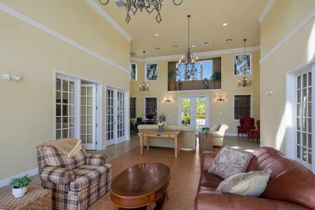 living room with an inviting chandelier, tile patterned floors, french doors, and a high ceiling