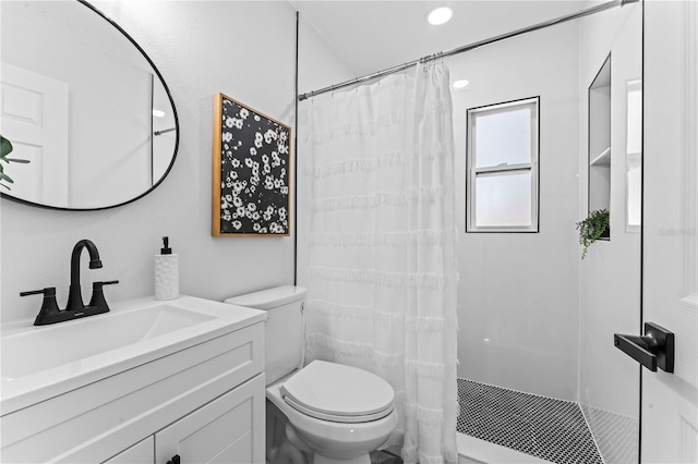 bathroom with a shower with shower curtain, toilet, and vanity