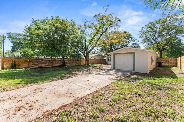 view of yard featuring a garage