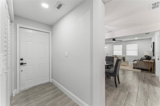 interior space with light hardwood / wood-style flooring and ceiling fan