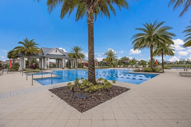 view of swimming pool with a gazebo and a patio