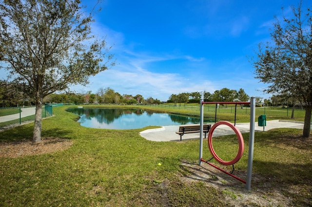 exterior space featuring a water view and a lawn