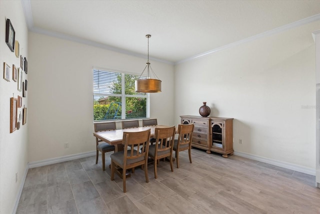 dining room featuring crown molding