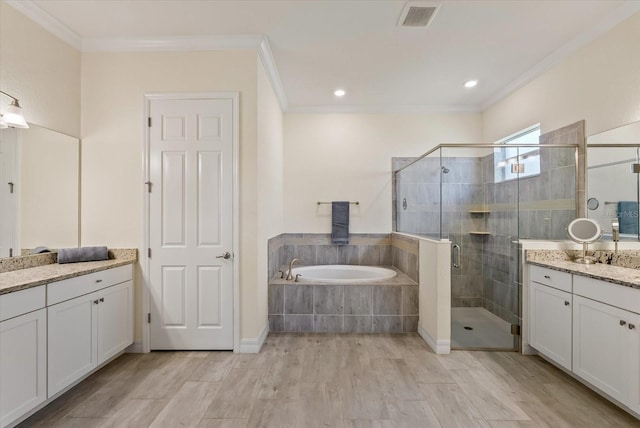 bathroom featuring shower with separate bathtub, vanity, and crown molding