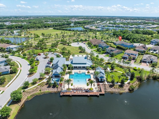 birds eye view of property with a water view