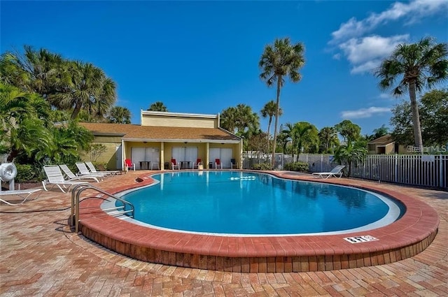 view of swimming pool with a patio