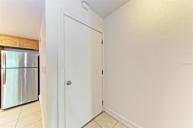 interior space featuring light tile floors