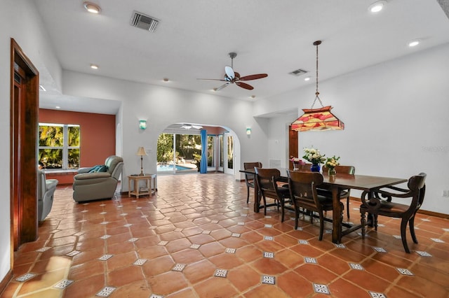 dining room with tile floors, ceiling fan, and a wealth of natural light