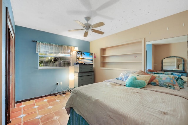 bedroom with light tile floors and ceiling fan