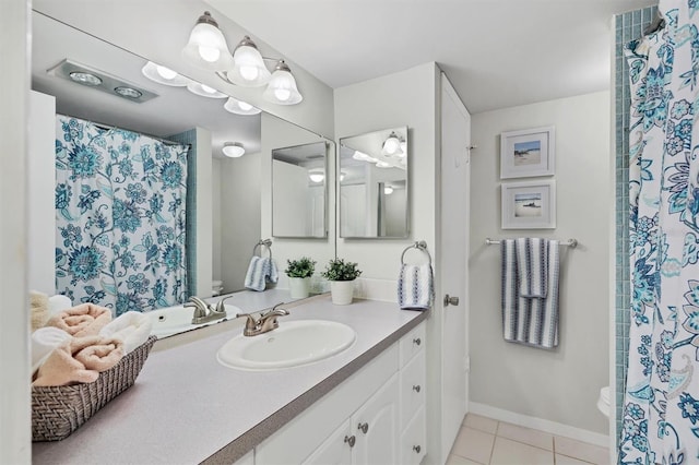 bathroom featuring tile floors, oversized vanity, and toilet