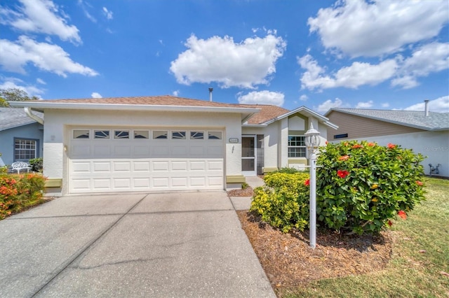 single story home featuring a garage