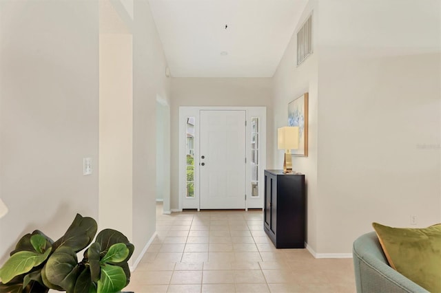 foyer featuring light tile patterned flooring