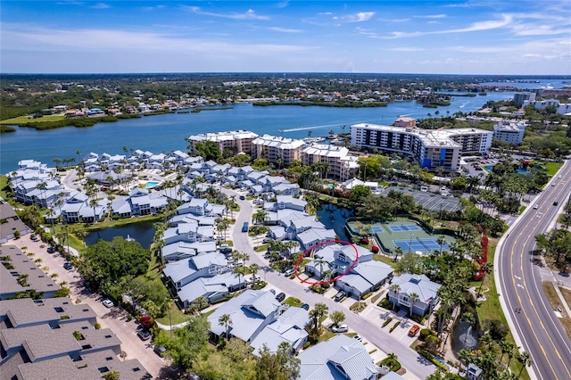 birds eye view of property with a water view