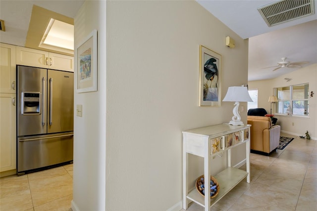 corridor featuring light tile flooring