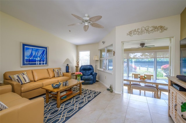 tiled living room featuring ceiling fan