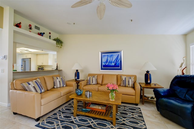 tiled living room featuring ceiling fan