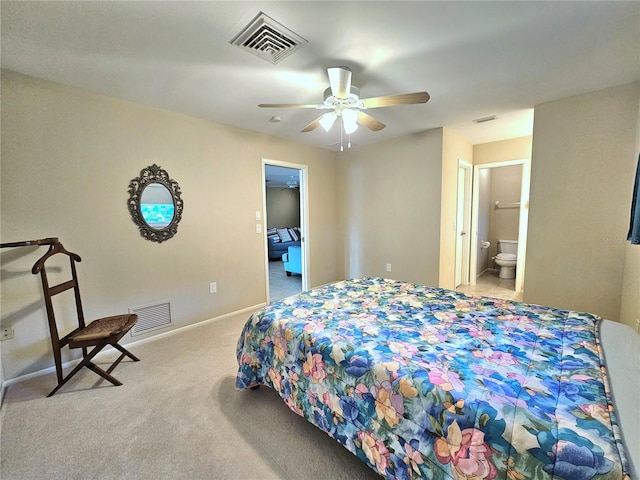 carpeted bedroom featuring connected bathroom and ceiling fan