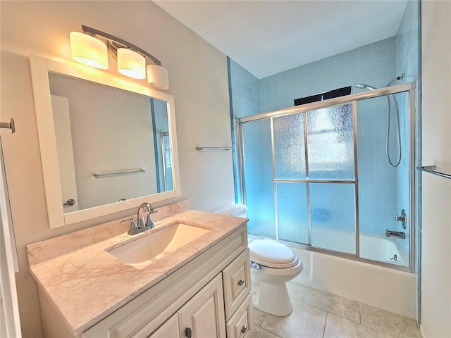 full bathroom with vanity, tile floors, shower / bath combination with glass door, and toilet