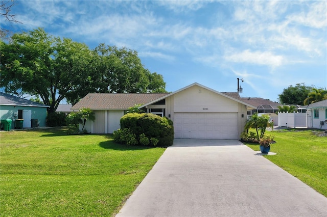 view of front of house featuring a front yard and a garage