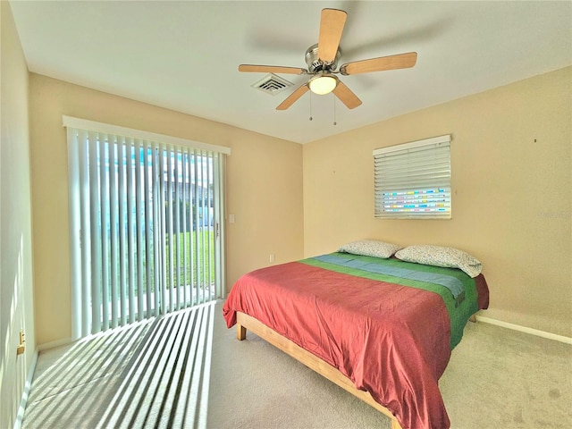 bedroom with light carpet, ceiling fan, and access to outside